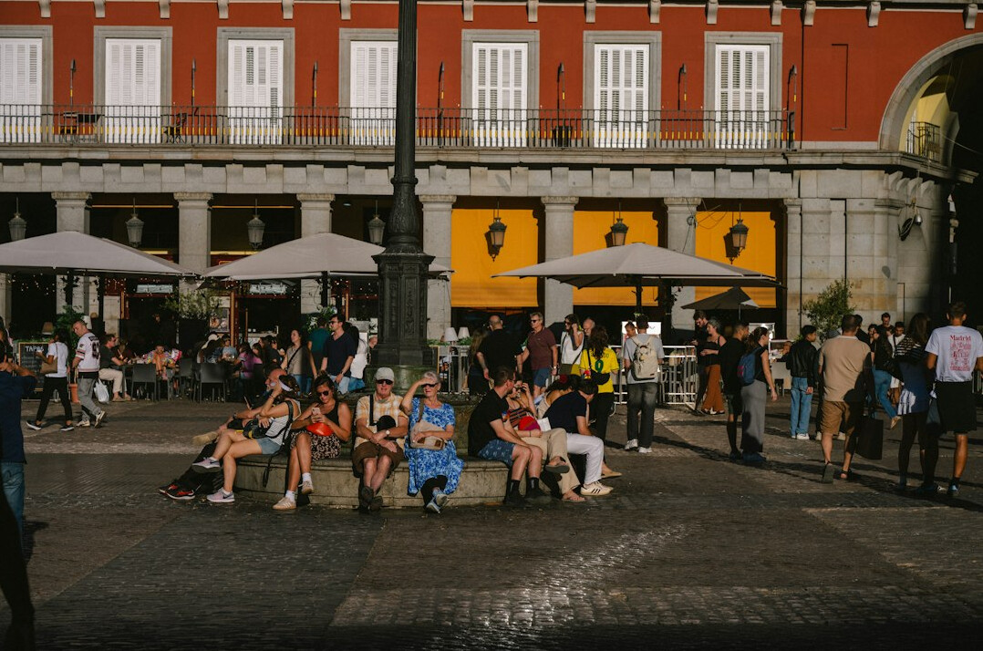 People gathered in a city plaza in the afternoon