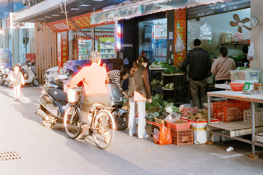 Vendors and shoppers at a traditional street market