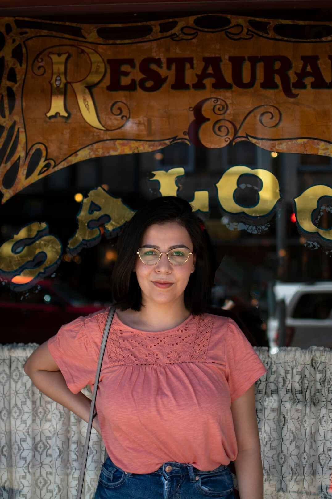 Portrait of a Latina woman editor with glasses